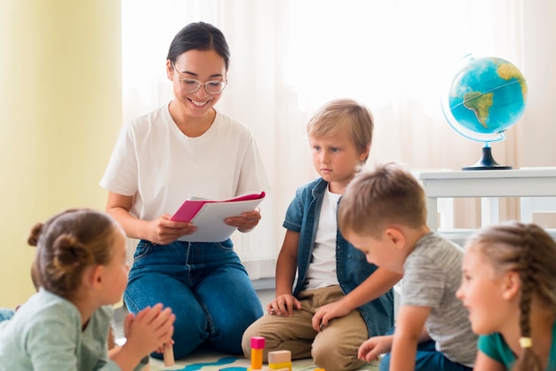 Kindergarten teacher holding a notebook