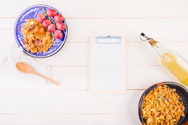 Kitchen desktop with food plates and clipboard