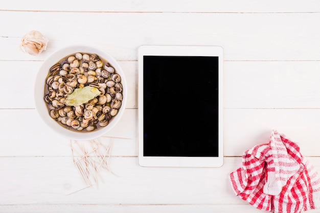 Kitchen desktop with snail plate and tablet