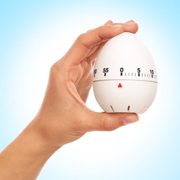 Kitchen timer in woman's hand