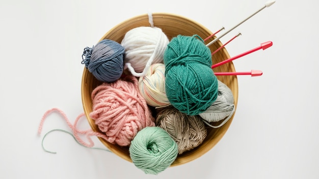 Knitting needles and wool in basket