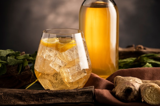 Kombucha bottle and glass assortment still life