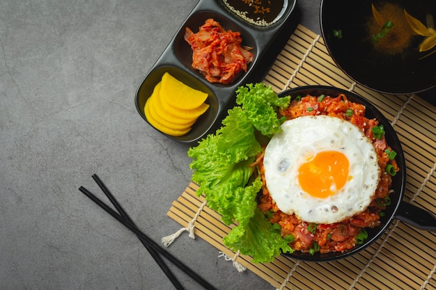 Korean food. fried rice with kimchi serve with fried egg