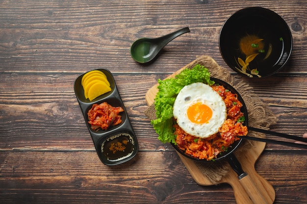 Free photo korean food. fried rice with kimchi serve with fried egg