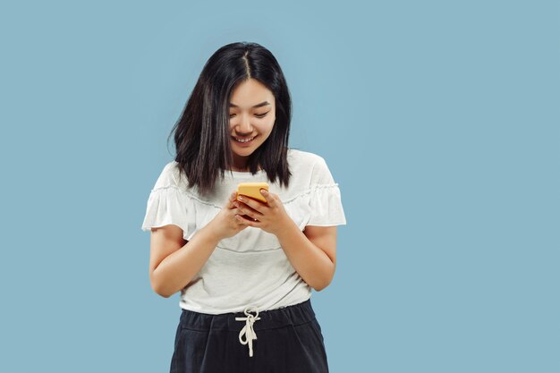 Korean young woman's half-length portrait on blue