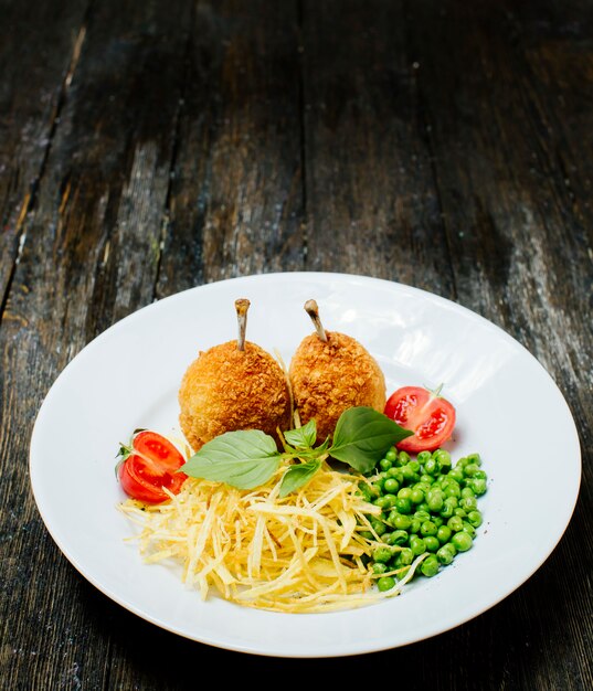 Kyev cutlets with bone, green beans and noodles