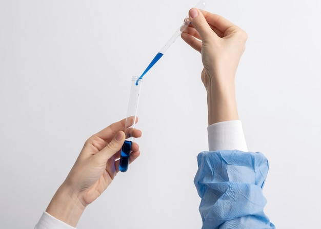 Lab doctor performing medical exam of urine