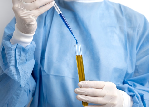 Lab doctor performing medical exam of urine