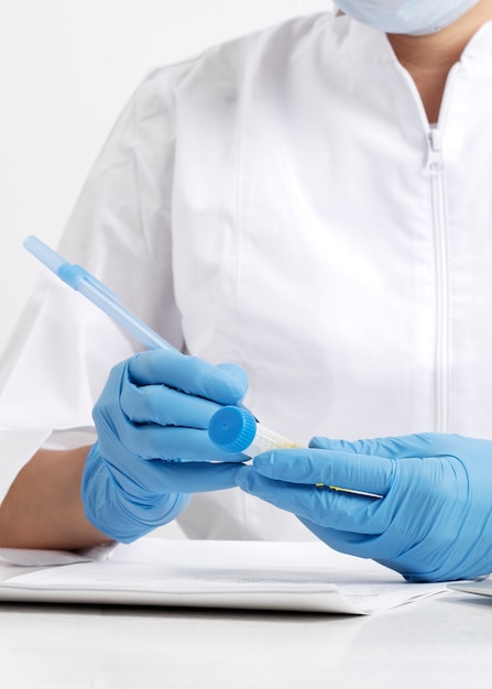 Free photo lab doctor performing medical exam of urine