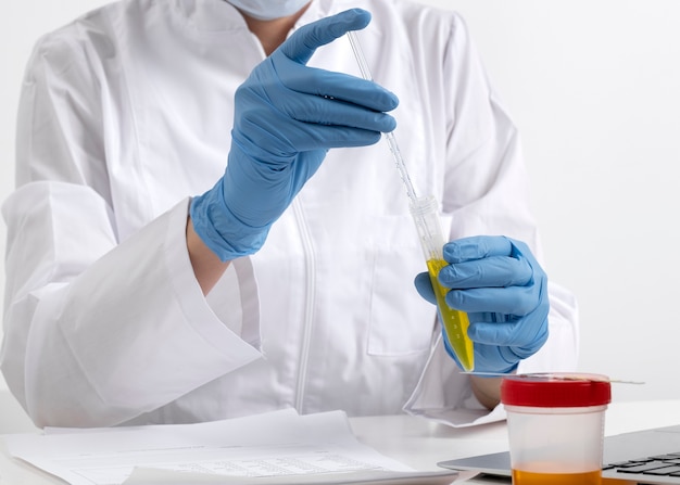 Free Photo lab doctor performing medical exam of urine