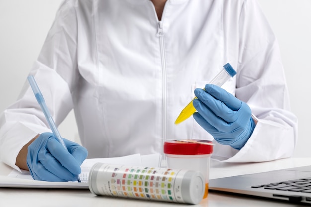 Free Photo lab doctor performing medical exam of urine