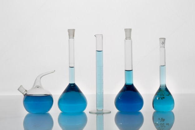 Free Photo lab glassware containing blue liquid  assortment