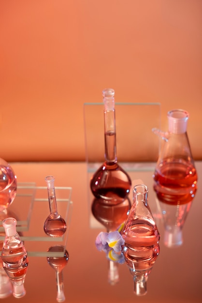 Free photo laboratory glassware assortment with red liquids