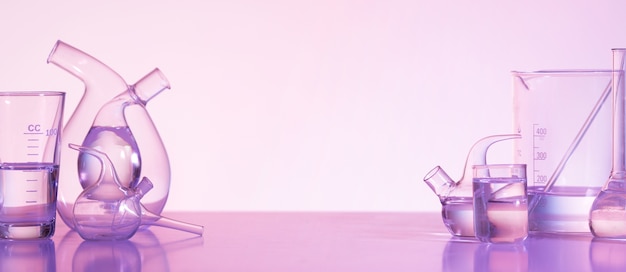 Free Photo laboratory glassware and pink background