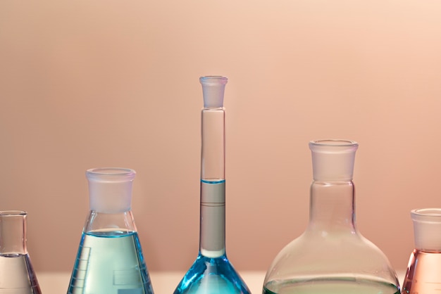 Free Photo laboratory glassware with colored liquid