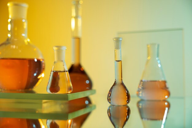 Laboratory glassware with orange liquid arrangement