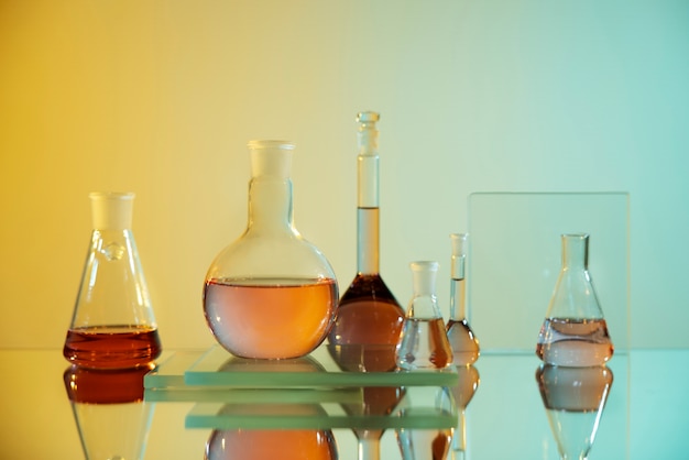 Laboratory glassware with orange liquid assortment