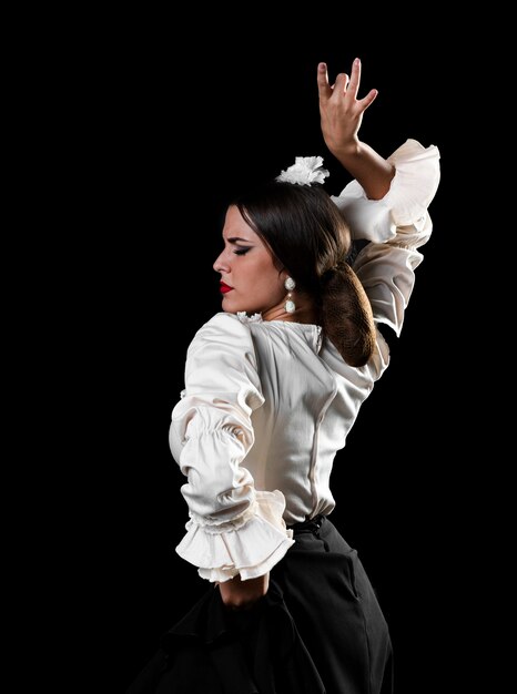 Lady dancing flamenco with arm up