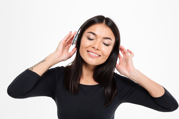 Lady listening music with headphones