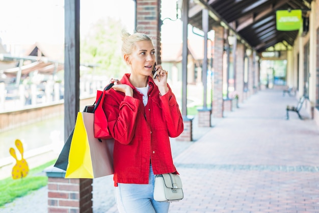 Lady talking smartphone on street