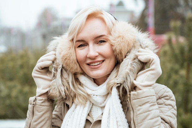 Lady in winter wearing ear muffs