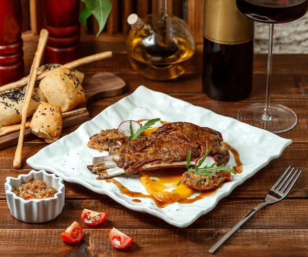 Lamb rib kebab served with grilled aubergine, tomato and bell pepper salad