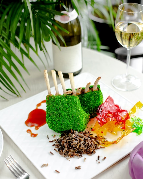 Lamb ribs covered with green coconut sprinkles served with thai rice