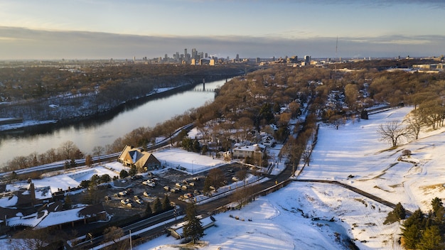 Free photo landscape of a city covered in the snow under the sunlight in winter