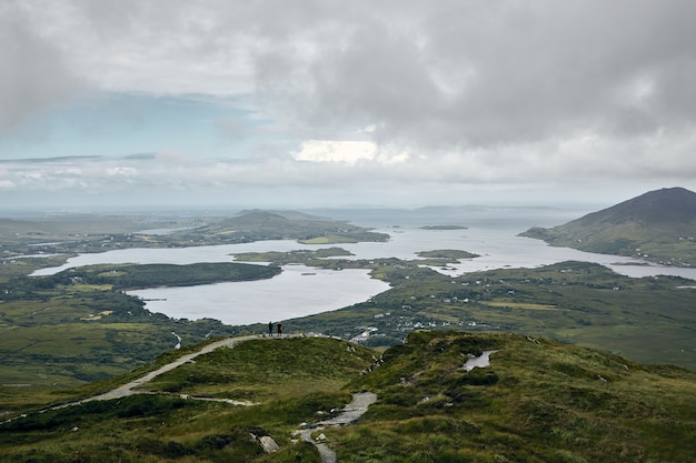 Landscape of the Connemara National Park surrounded by the sea under a cloudy sky in Ireland