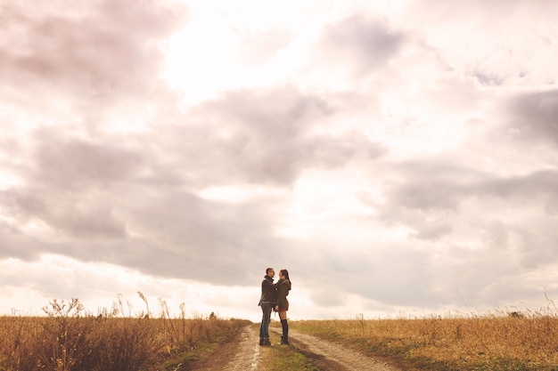 Landscape portrait of young beautiful stylish couple sensual and having fun outdoor