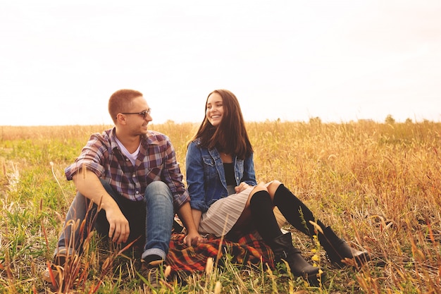 Landscape portrait of young beautiful stylish couple sensual and having fun outdoor