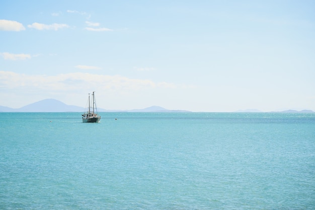 Free Photo landscape of the sea with a ship on it under a blue sky and sunlight