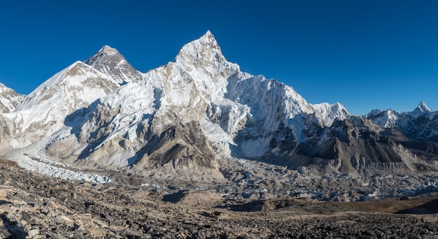 Landscape shot of a beautiful valley surrounded by huge mountains with snowy peaks