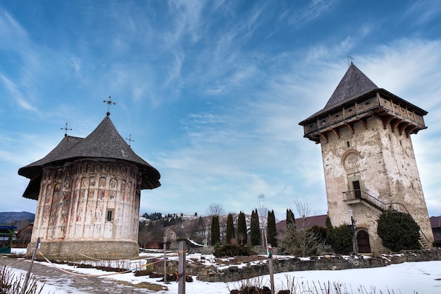 Free photo landscape of two religious transilvanian romanian monasteries built in a rustic style