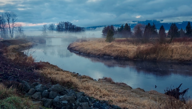 Landscape with lake and fog