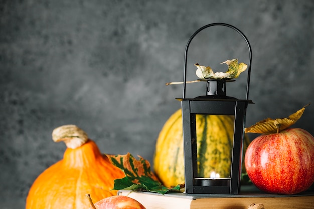 Free photo lantern in foliage on books