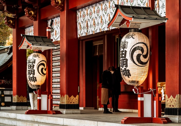 Free photo lanterns hanging at the entrance of japanese temple