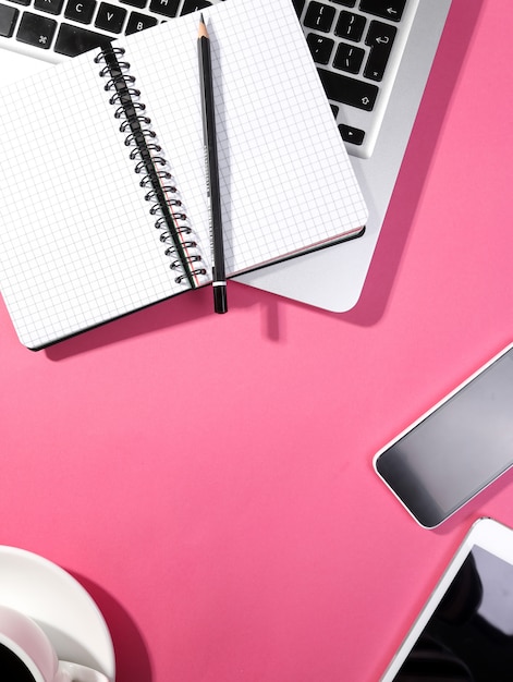 Laptop, notepad, smartphone and tablet on the table