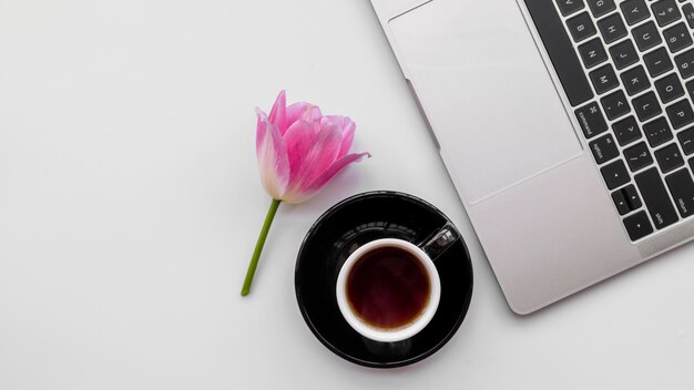 Laptop with flowers and coffee cup 