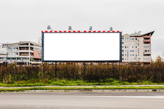 Free photo large billboard in front of building on the roadside