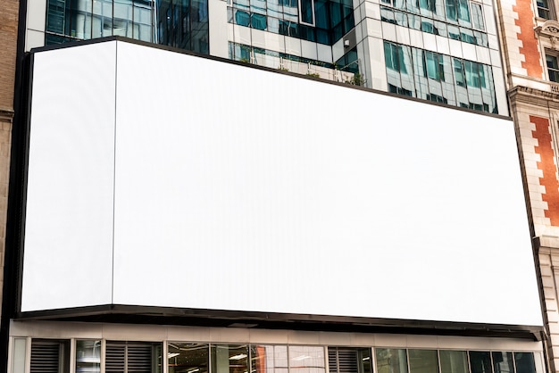 Free photo large mock-up billboard on a city building