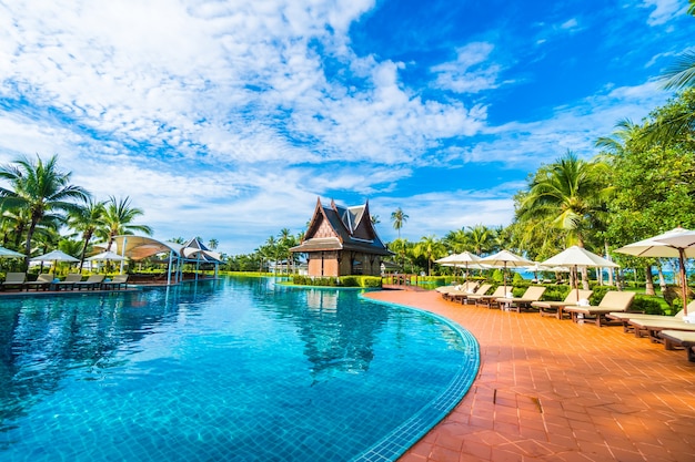 Large pool with umbrellas and hammocks