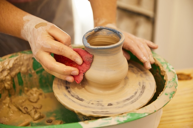 Free photo last moments of molding a pottery