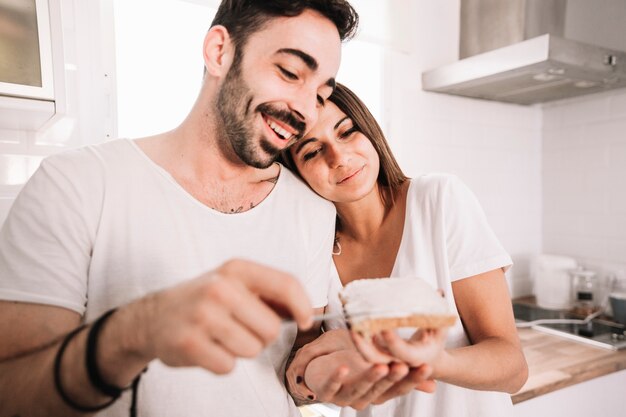 Laughing couple making toasts together