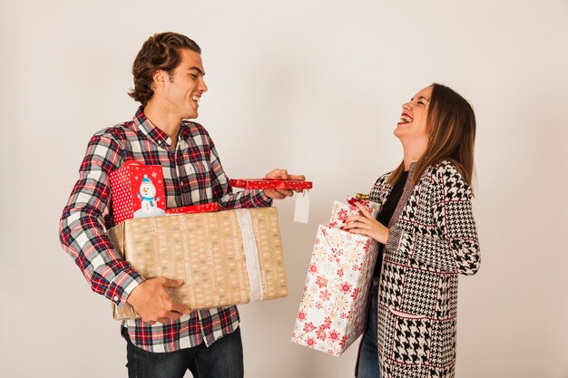 Laughing couple with presents