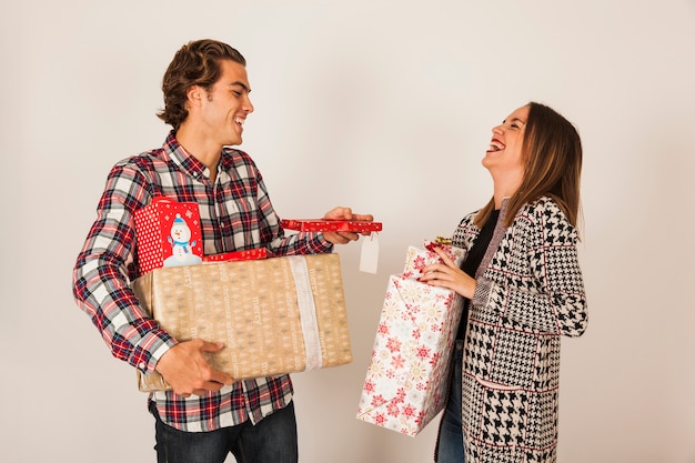 Laughing couple with presents