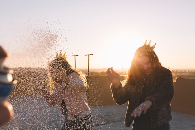 Free photo laughing girls under foam