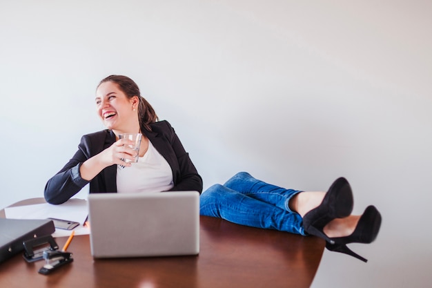 Free Photo laughing office worker drinking water