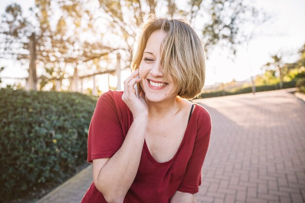 Laughing woman speaking on phone