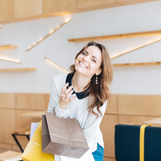 Laughing woman with paper bags